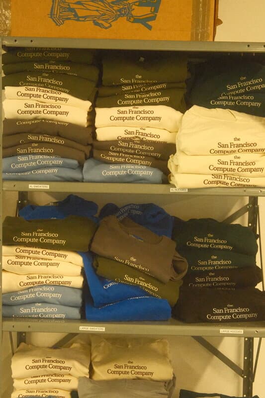 Shelves of San Francisco Compute Company sweatshirts