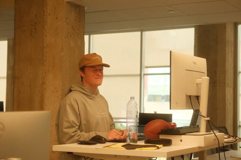 A teammate at a standing desk